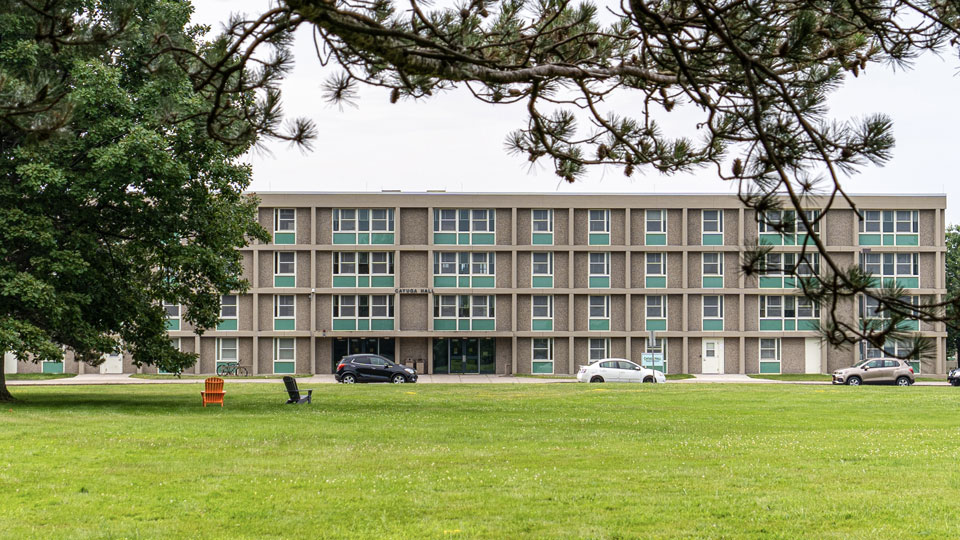 Vast lawn sprawls before Cayuga Hall